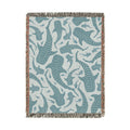Whale Shark woven blanket in teal and cream with spotted whale sharks, shown flat