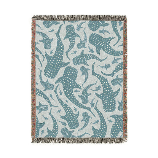 Whale Shark woven blanket in teal and cream with spotted whale sharks, shown flat