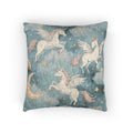 Woven pillow with cream winged unicorns, crescent moons and stars on a teal blue ground, front view