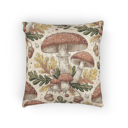 Woodland mushroom woven pillow featuring red-capped toadstools, golden oak leaves and acorns on a cream ground