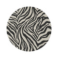 Zebra round rug in black and cream with a zebra stripe pattern, shown flat