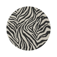 Zebra round rug in black and cream with a zebra stripe pattern, shown flat