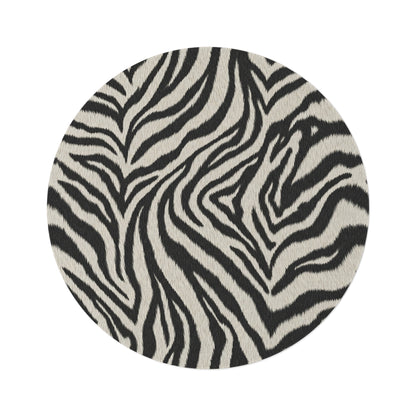 Zebra round rug in black and cream with a zebra stripe pattern, shown flat