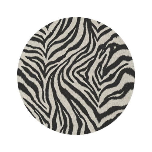 Zebra round rug in black and cream with a zebra stripe pattern, shown flat