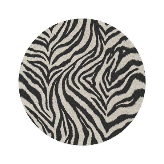 Zebra round rug in black and cream with a zebra stripe pattern, shown flat