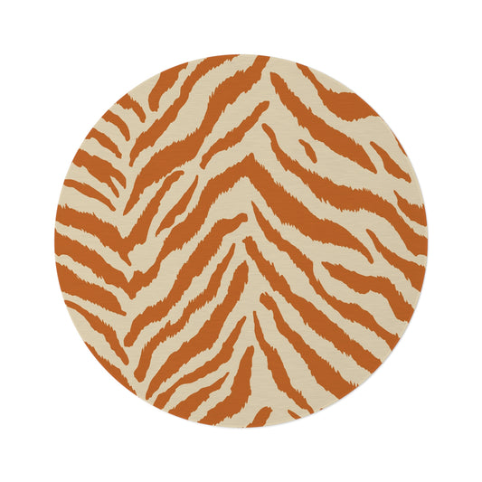 Round rug with terracotta zebra stripes on a cream ground, shown flat