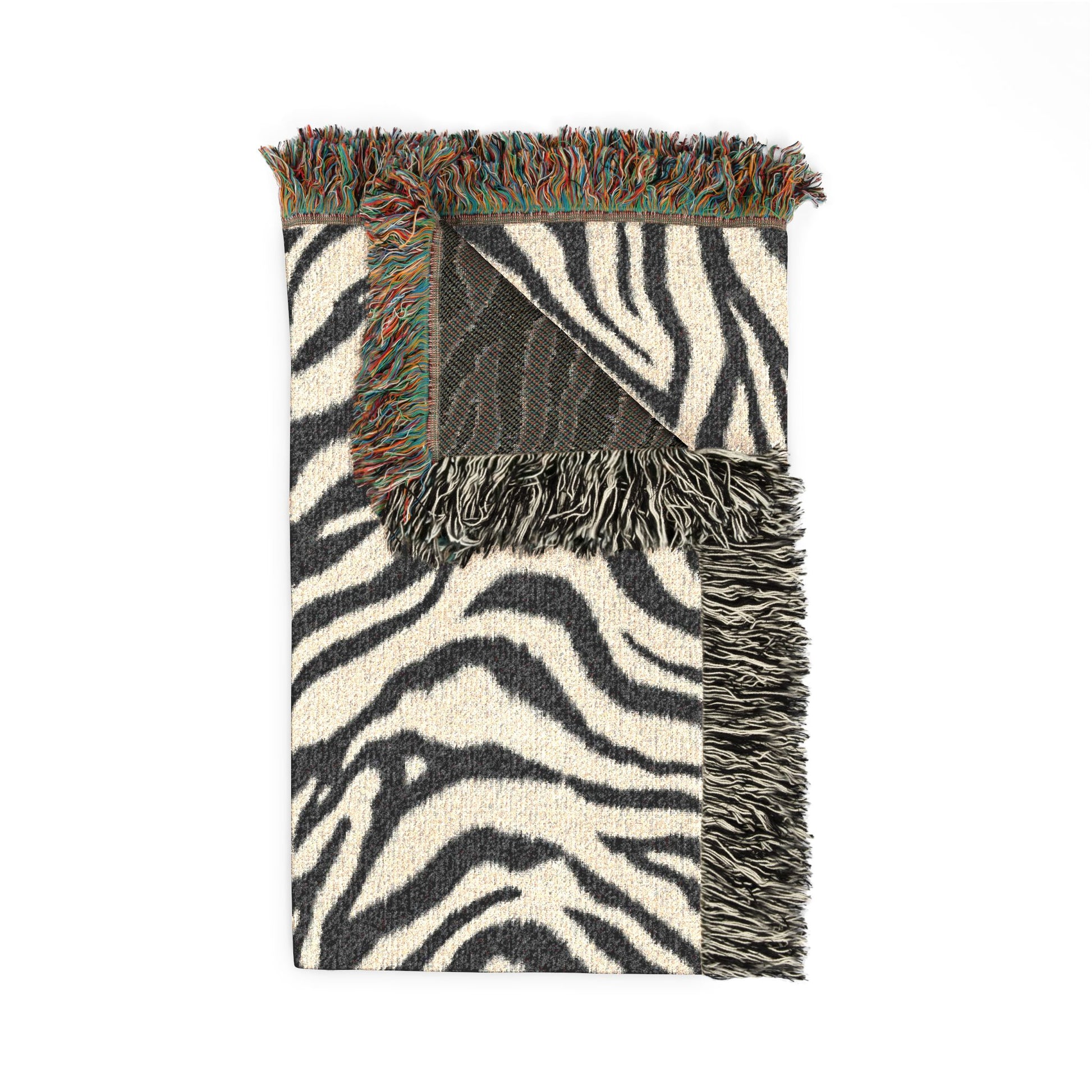 Folded Zebra woven blanket showing the fringed edge and the charcoal reverse side