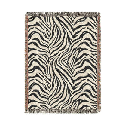 Zebra woven blanket in black and cream with a zebra stripe pattern, shown flat